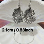 Vintage Bohemian style heavy metal hollowed out carved butterfly flower hanging earrings, integrating ethnic flower design with unique personality, versatile for daily use in spring, and preferred for women's high-end earring