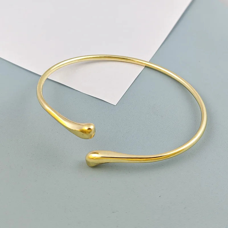 European and American style hot-selling models, women's irregular opening gold bracelets, retro versatile water drop-shaped round arm rings for women