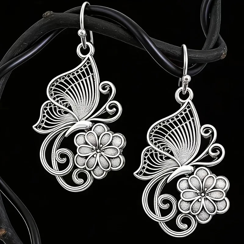 Vintage Bohemian style heavy metal hollowed out carved butterfly flower hanging earrings, integrating ethnic flower design with unique personality, versatile for daily use in spring, and preferred for women's high-end earring