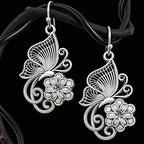 Vintage Bohemian style heavy metal hollowed out carved butterfly flower hanging earrings, integrating ethnic flower design with unique personality, versatile for daily use in spring, and preferred for women's high-end earring