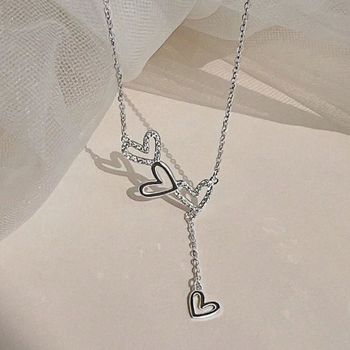 An elegant and minimalist rhinestone three-love fringed pendant necklace with a luxurious and versatile design for ladies, brides, engagement jewelry, girlfriends or Valentine's Day gifts.