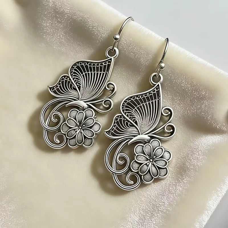 Vintage Bohemian style heavy metal hollowed out carved butterfly flower hanging earrings, integrating ethnic flower design with unique personality, versatile for daily use in spring, and preferred for women's high-end earring