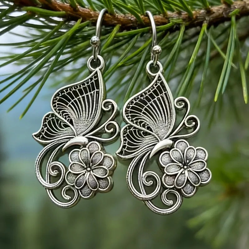 Vintage Bohemian style heavy metal hollowed out carved butterfly flower hanging earrings, integrating ethnic flower design with unique personality, versatile for daily use in spring, and preferred for women's high-end earring