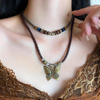 Boho Necklace for Women,Vintage Butterfly Pendant Necklaces,Adjustable Wooden Beads Layered Braided Choker,Fashion Tribal Style Leather Rope Necklace Jewelry,Chunky Statement Gift for Women