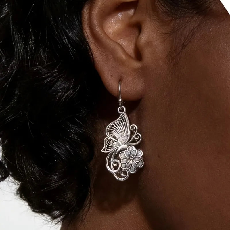 Vintage Bohemian style heavy metal hollowed out carved butterfly flower hanging earrings, integrating ethnic flower design with unique personality, versatile for daily use in spring, and preferred for women's high-end earring