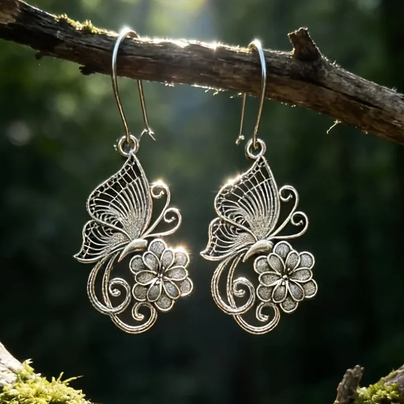 Vintage Bohemian style heavy metal hollowed out carved butterfly flower hanging earrings, integrating ethnic flower design with unique personality, versatile for daily use in spring, and preferred for women's high-end earring