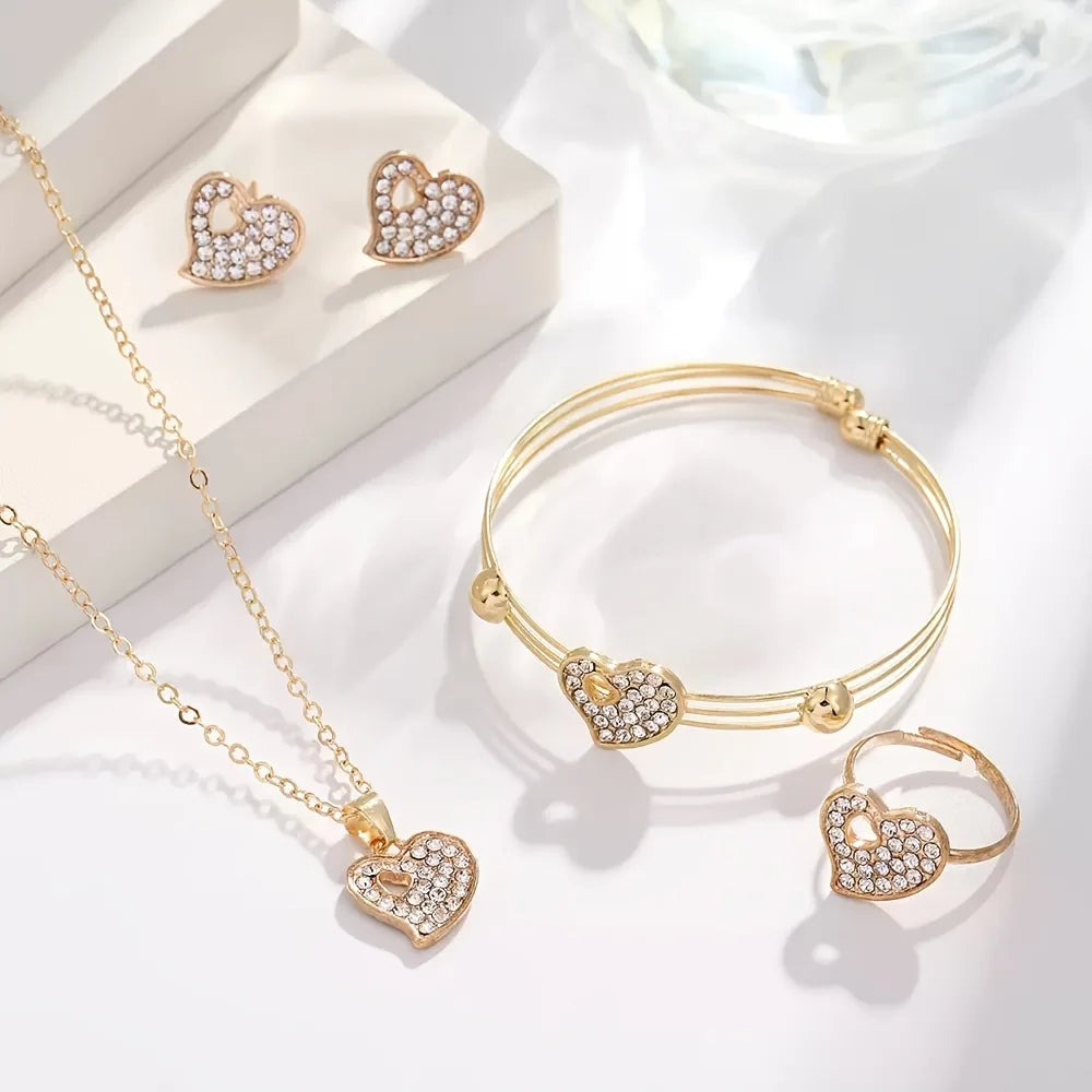 A 4-piece fashion jewelry set that includes rhinestone jewelry, including peach heart pendant necklaces, rings, studs, and bracelets, perfect for everyday wear or parties. mbzr